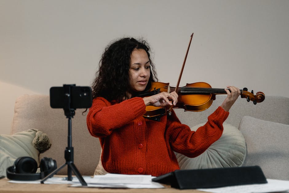 Young artist recording violin with professional digital tools